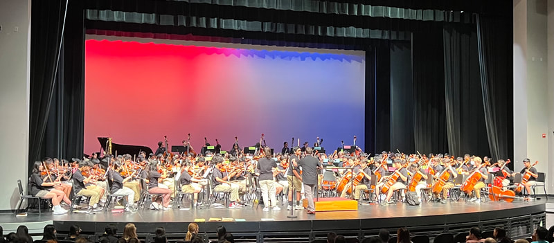 Saratoga orchestra students performing on stage